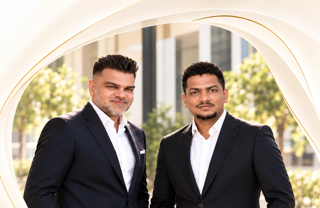 ZARYA co-founders Moin Kazi and Abdul Gani Shaikh, framed by a champagne arch